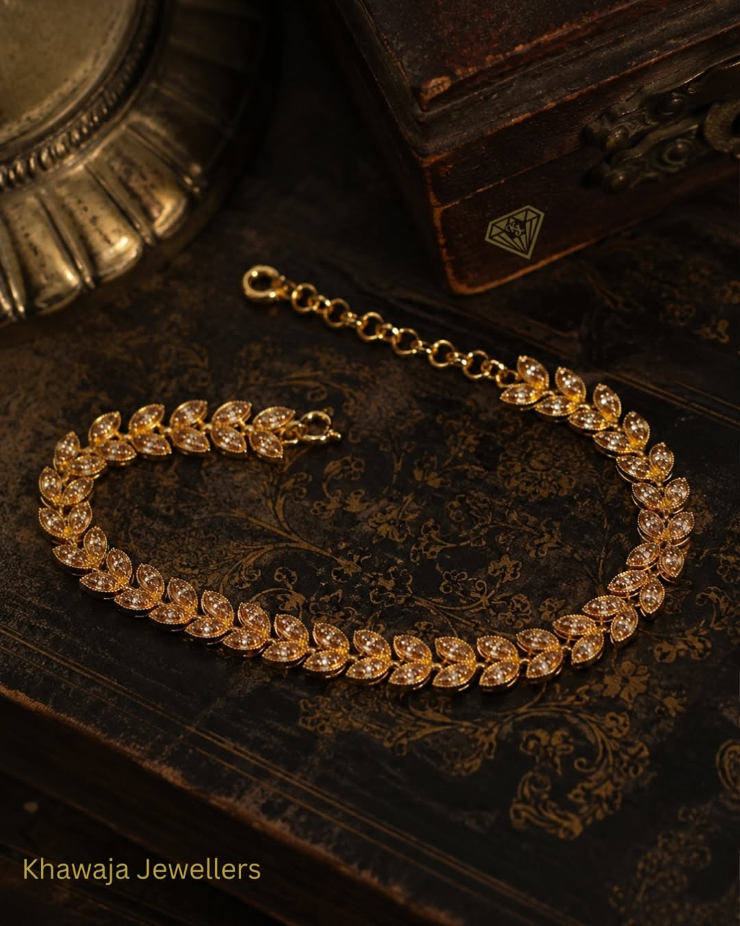 Vintage gold bracelet on antique book
